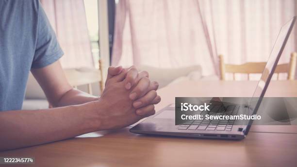 Praying Hands With Laptop Worship Online At Home Streaming Online Church Service Social Distancing Concept Stock Photo - Download Image Now