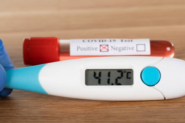 istock Covid-19 blood sample and thermometer 1222346478