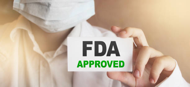 FDA Approved words on card Doctor shows. Food and Drugs Association approved products concept FDA Approved words on card Doctor shows. Food and Drugs Association approved products concept. food and drug administration stock pictures, royalty-free photos & images