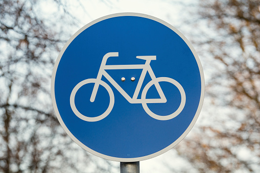 Sign for bicycle painted on the asphalt. Detail of road sign for cyclists in the city, sports and transport respecting the environment.