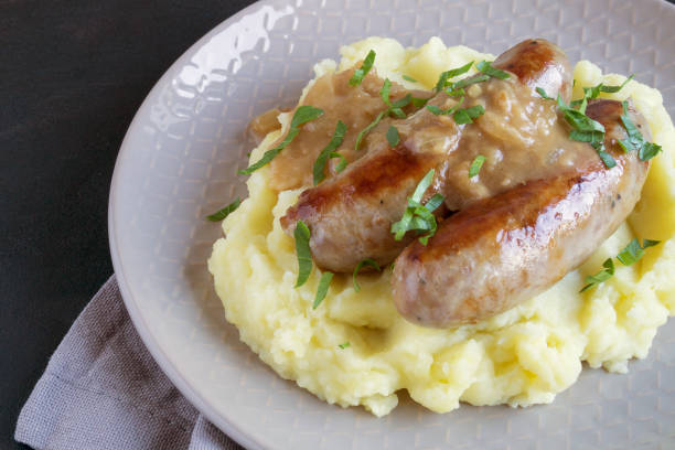 istock English sausages with mashed potatoes and gravy. 1222350219