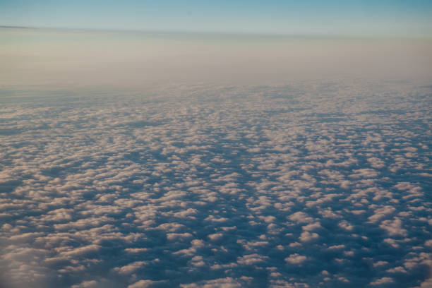 istock flying above the clouds at sunset landscape from an airplane 1222351445