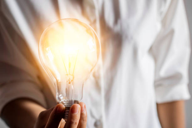istock A young woman's hand with a light bulb Conceptual ideas with innovation and inspiration And creativity 1222351650