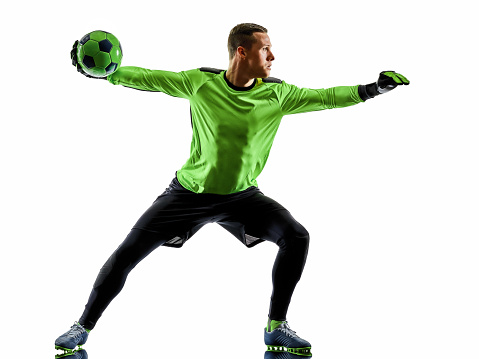 Leader. Close up legs of professional soccer, football player fighting for ball on field isolated on white background. Concept of action, motion, high tensioned emotion during game. Cropped image.