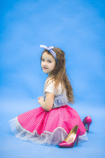 istock Thoughtful but smiling girl looking at a camera. 1222353161