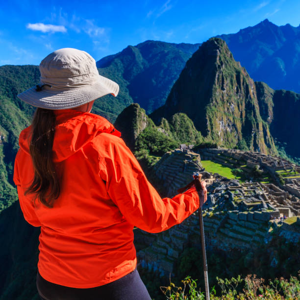 istock Female tourist looking at Machu Picchu 1222354623