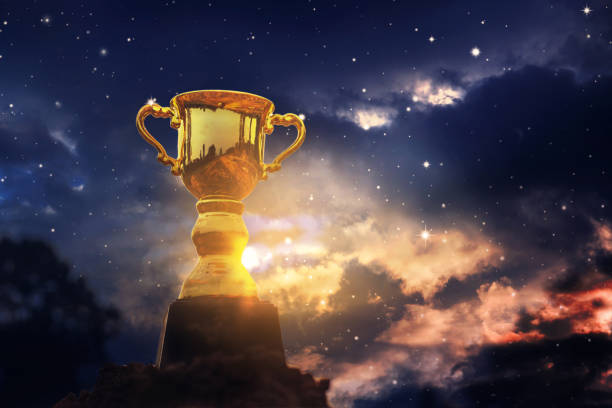 istock Gold trophy cup on top mountain with sunrise sky. 1222355556