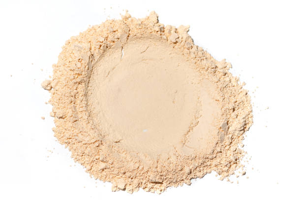 whitening mineral loose powder.scattered tan colored facial loose powder on white background. - powder puff imagens e fotografias de stock