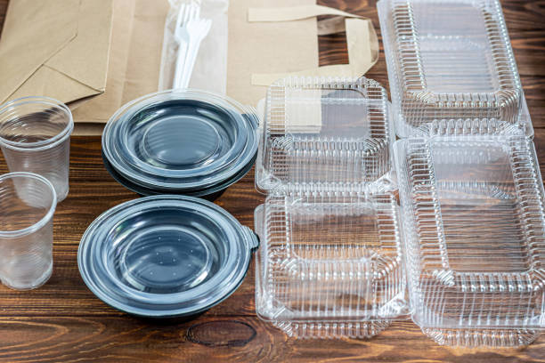 istock Plastic dishes for home delivery. Quarantine, diet, proper nutrition. Disposable container, paper bag. 1222359828