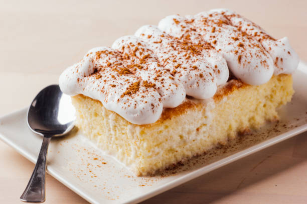 Tres leches cake, typical Latin American dessert, is made of condensed milk, evaporated milk and milk cream stock photo