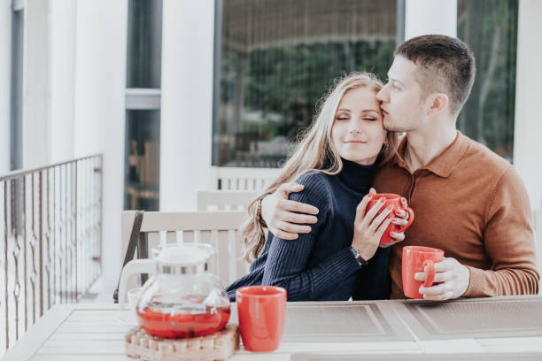 husband and wife on holiday drink hot chocolate coffee tea husband and wife on holiday drink hot chocolate coffee tea 1 mum new boyfriend stock pictures, royalty-free photos & images