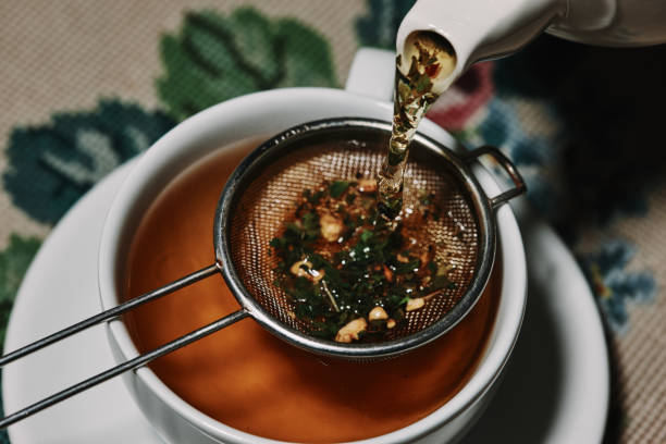 pouring herbal tea series of images - caffeine free imagens e fotografias de stock
