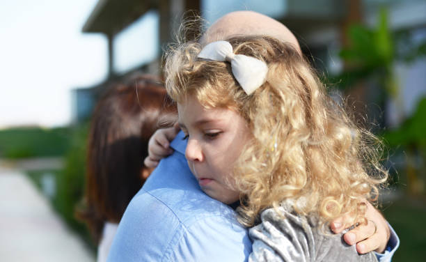 istock Pretty blondy girl is cuddling with her father 1222366997