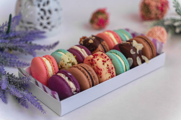 istock Macaron cake of different colors of large size in a beautiful layout on a light white background 1222367189