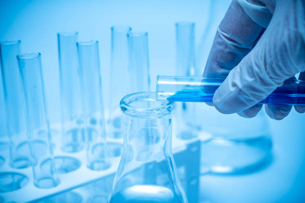 istock A researcher's hand holding a test tube containing blue liquid. 1222367920