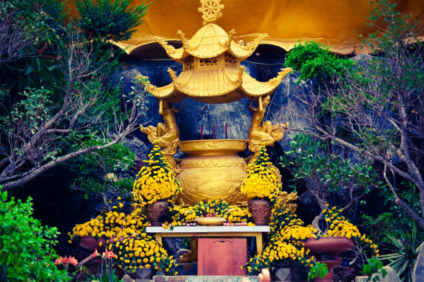 istock traditional buddhist statue with flowers in thailand 1222369710