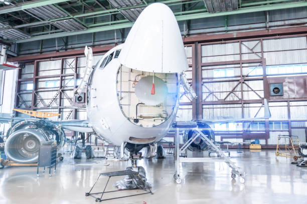 istock Passenger jet plane under maintenance. Checking mechanical systems of aircraft for flight operations. Front view 1222369788