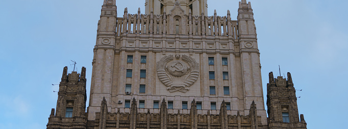 Photography of coat of arms of the USSR. Soviet state sign. Suitable for touristic guide, poster, banner, greeting card.