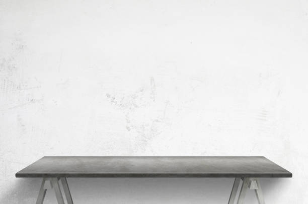 istock Clean gray table front of white concrete wall 1222371130