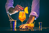 Bartender serving Spritz cocktail