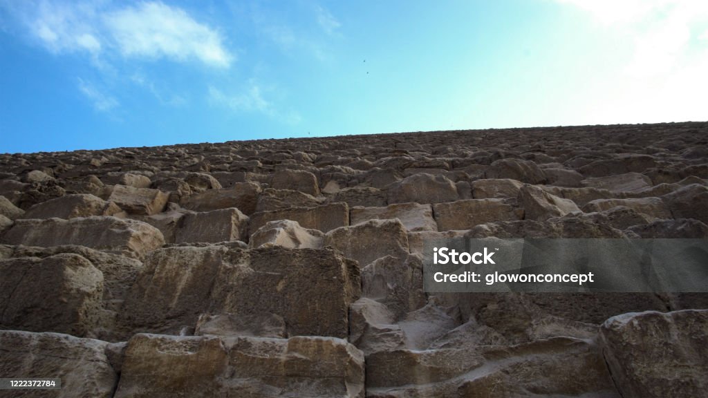 The Great Pyramid of Giza Al Haram Egypt pan from pyramid base low angle up to sky Africa Stock Photo