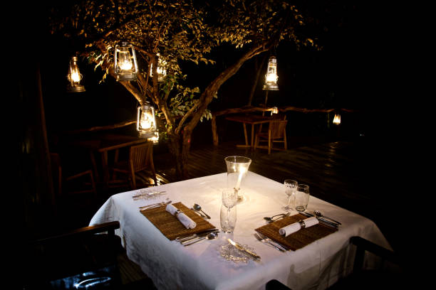 Bush Dinner With Candle Light In Masai Mara In Masai Mara In Kenya candle light dinner stock pictures, royalty-free photos & images