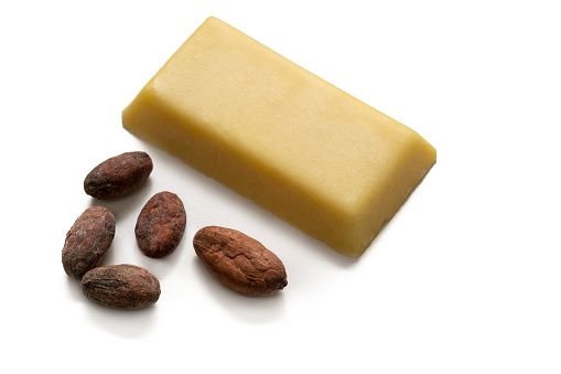 cocoa butter bar with cocoa nuts cacao isolated on white background