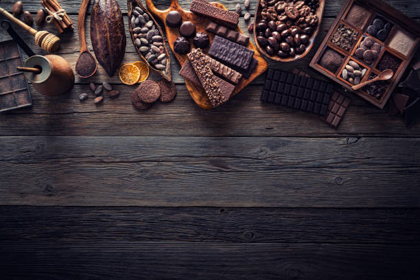 istock Assorted chocolate products with bars cocoa beans nuts spices rustic 1222376440