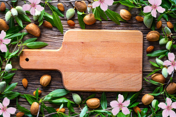 istock Almonds copy space border frame cutting board almond tree fruits 1222378853
