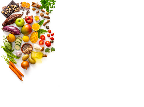 Assorted food fruits and vegetables varied on white background copy space