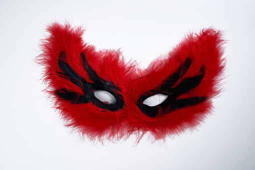 feather face mask on white background