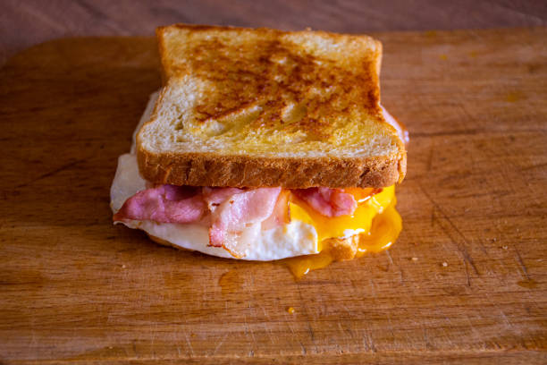istock Sandwich with Egg, Bacon, Cheese and Spicy Sauce 1222382848
