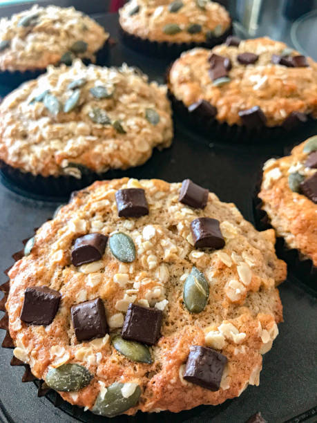 Freshly baked chocolate chip and pumpkin muffins in the tin