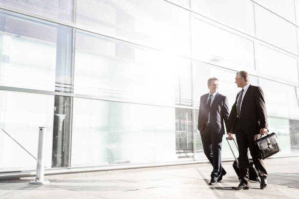 istock Mature businessmen walking while talking in the airport 1222386745