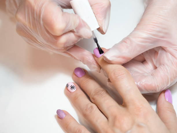 istock Manicure procedures. Nail uv-varnish, close-up 1222386787
