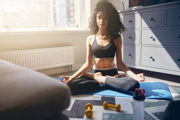 istock Relaxed young female doing meditation at home 1222387747