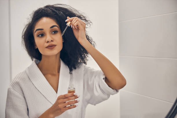 istock Girl holding a pipette in her hand 1222387839