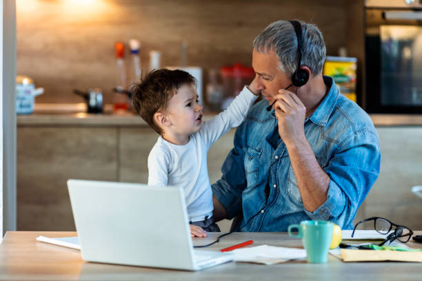 istock Mature Father with son working at home 1222387879