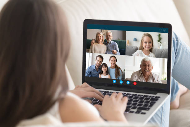 istock Young female have online video call on laptop with relatives 1222388006