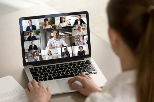 istock Female employee engaged in webcam conference with diverse colleagues 1222389468