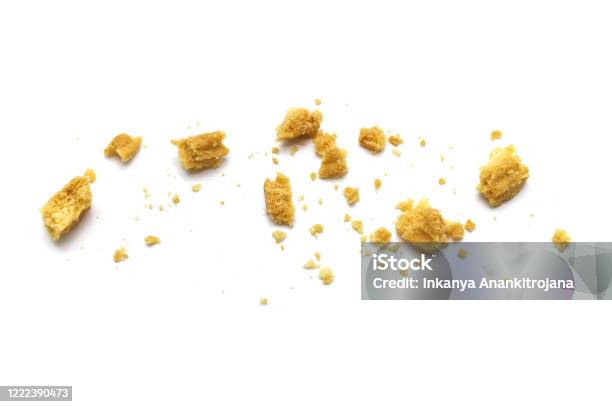 Scattered Crumbs Of Butter Cookies On White Background Stock Photo - Download Image Now