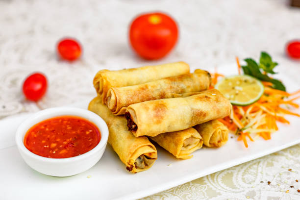 istock Pancakes stuffed with meat and carrots with spicy sauce 1222392676
