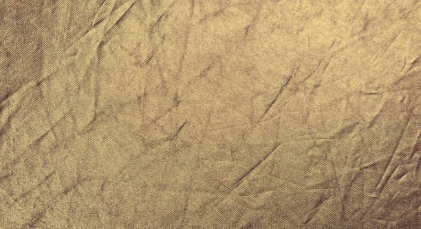 istock Wrinkled bright goldr fabric. Texture background for design. 1222392721