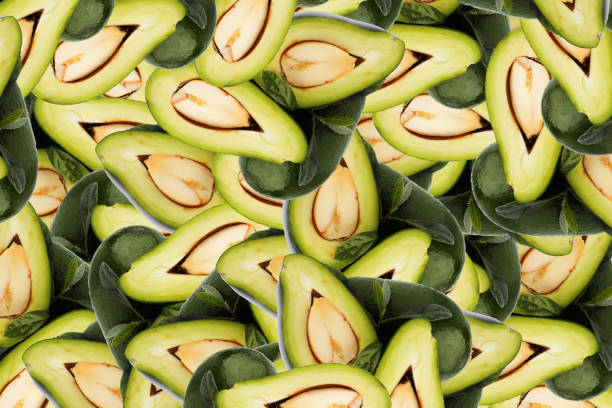 A lot of halved avocados with leaves