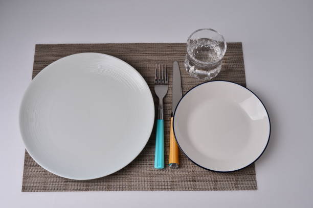 istock Striped dish,white dish,checkred dish,cutting board,fork and knife table setting 1222398479