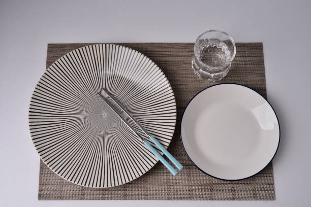 istock Striped dish,white dish,checkred dish,cutting board,fork and knife table setting 1222398494