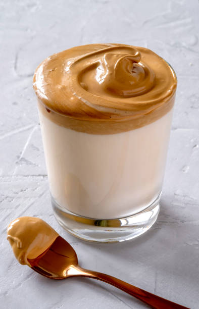 istock Dalgona Coffee. Milk topped with whipped instant coffee. 1222401424