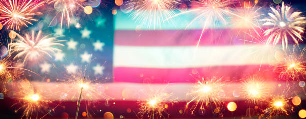 istock Usa Celebration With Fireworks And Sparklers On Blurred American Flag 1222401718