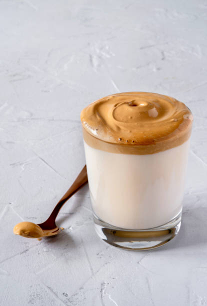 istock Dalgona Coffee. Milk topped with whipped instant coffee. 1222401845