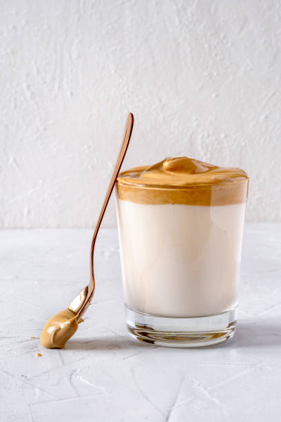 istock Dalgona Coffee. Milk topped with whipped instant coffee. 1222404204